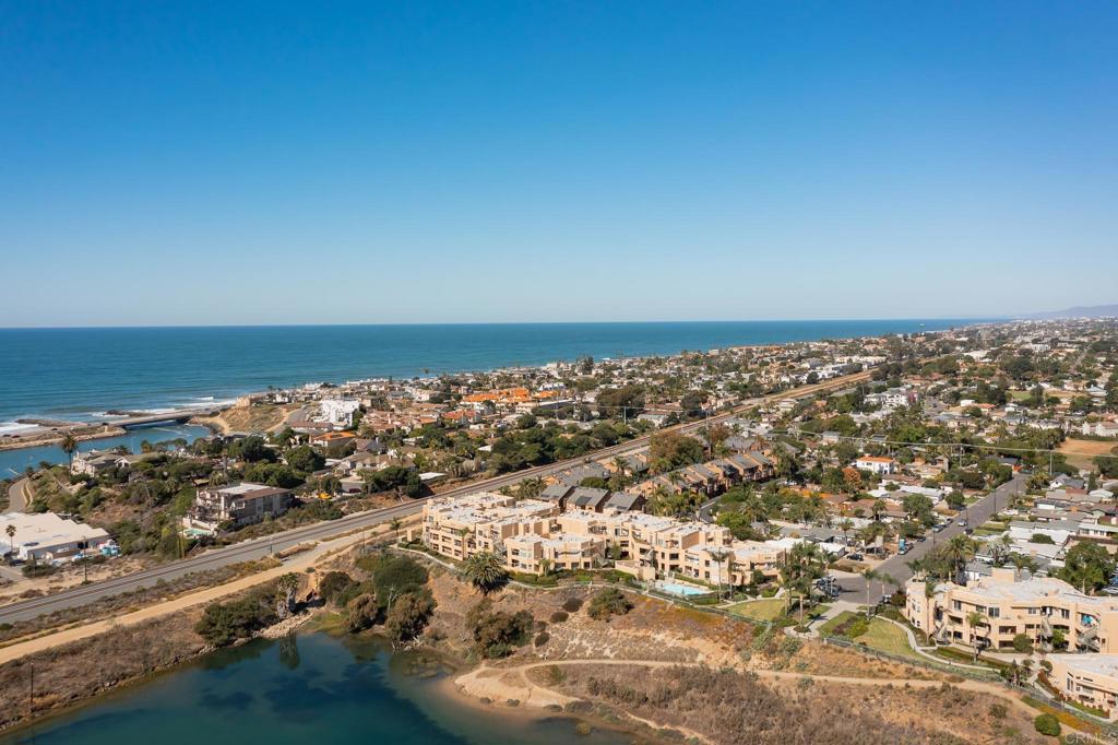 Enjoy the ocean breeze and year round resort style coastal living in this immaculate, turnkey two bedroom/two bath single level. Nestled atop the Agua Hedionda Lagoon in the gated community of Ocean Pointe you'll feel like your on vacation all year long. Enjoy this one-level open floor plan with high profile ceilings in living room with cozy gas fireplace adjacent to the spacious dining room area. Light and bright updated kitchen with reverse osmosis water system, butcher block island, and eat in breakfast nook. The ample master bedroom ensuite has two closets (one walk-in), with a generous master bath which includes dual sinks, oval soaking tub, with separate walk-in glass shower. Glass sliders in master bedroom & living room lead to the relaxing patio with easy patio door access to the pool & spa. Secure, gated underground parking garage with two assigned spaces and guest parking. Parking spaces (#95 & 96) are located very close to your own private and secure storage room. The elevator (#12) is located just across from your parking spaces for easy access to the unit. Take advantage of the walking trails, kayaking on the lagoon, the beautiful beaches and close by downtown Carlsbad Village with wonderful restaurants and shops. Easy freeway access to all San Diego has to offer.