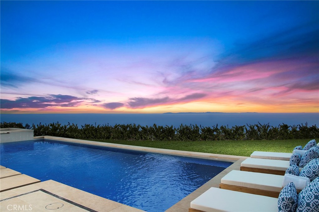 INCREDIBLE PRICE REDUCTION OF OVER $2,800,000! Seller will consider carrying up to $15,000,000 with deferred interest payments until January, 2019. BRAND NEW CONSTRUCTION is presented at 10 Coral Ridge. This elegant California-Mediterranean style estate is adorned with transitional interiors and offers panoramic ocean, Catalina, coastline & city light views. Designed by EBTA architects, the stunning estate is accentuated by soaring ceilings made possible by a unique 35-foot height allowance. Volume & light flood the interiors affording ample opportunity to relish in the home's extraordinary details. The magnificent great room blends seamlessly with the outdoor loggia through a large set of remote-controlled pocket doors. The gourmet kitchen features two islands w/ bar seating & professional-grade appliances, while the formal living and dining rooms feature stunning coffered ceilings. Upstairs, the sumptuous master suite offers his/her master bathrooms w/walk-in closets. 3 additional guest suites, a bonus room & outdoor patio comprise the 2nd floor. On the lowest level, indoor entertaining abounds w/ full bar, bonus room, wine cellar, billiards room, theater & gym/bedroom w/ full bathroom. Additional highlights incl. a Savant smart home system, saltwater pool and spa with liquid nitrogen water purification system, whole-house air scrubber system, wood paneled office, main level bedroom suite, pool & spa, outdoor firepit, elevator, BBQ & a 6-car subterranean garage.