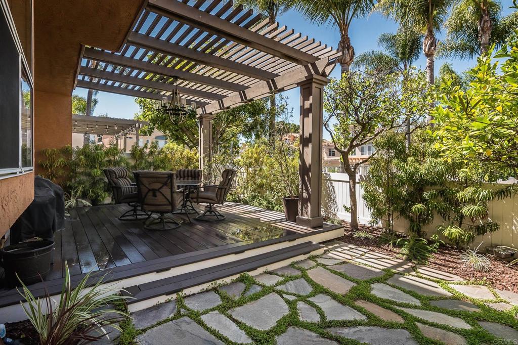 A real gem in excellent condition. You will feel the love and care this home has had as soon as you walk in the door. The kitchen and baths have been remodeled with top-notch quality products. The kitchen has stainless steel appliances and hand rubbed paint with glaze cabinets. The bathrooms have marble counter tops and tile showers. The two bedrooms upstairs each have their own private bathroom. Both bedrooms have mirrored sliding closet doors and ceiling fans. Downstairs has ceramic tile flooring and upstairs has upgraded carpet. There is a cozy fireplace in the living room. The covered patio is absolutely delightful with an Azek deck, hanging chandelier, slate pavers with dichondra ground cover and a lemon tree. Enjoy the pool view and open space view from the patio. The two-car garage has custom storage as well as a sink and extra oven. The complex has green belt areas, pool and spa. Don't miss this one.