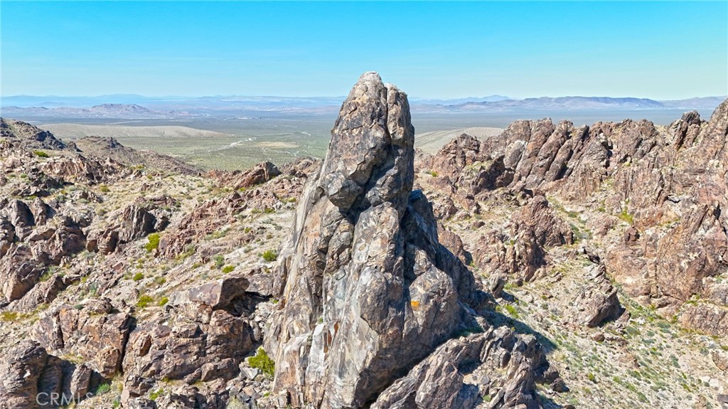 120 Acres Nestled between the grandeur of the Ord Mountains to the southwest and the serene San Bernardino Mountains to the north lies a captivating expanse of 120 acres of flat lands and a majestic mountain, revered by rock climbers worldwide. This tranquil haven, located in close proximity to Barstow, serves as a gateway to boundless recreational adventures. Situated amidst the bustling transportation hub of the Inland Empire, including the renowned Brightline Railway connecting Las Vegas to Rancho Cucamonga, this property offers a rare blend of accessibility and seclusion. Whether you seek a private camping retreat or crave adrenaline-fueled escapades, this land promises endless possibilities. Merely 20 minutes from the vibrant city of Barstow, this parcel of paradise beckons enthusiasts of off-road thrills with its proximity to popular destinations like Slash-X and the expansive BLM riding areas. Accessible via Barstow Rd (Highway 247) and a short drive along a dirt road, the journey to this haven is as exhilarating as the destination itself.
Nature enthusiasts will delight in the abundance of recreational opportunities that surround this property. Just northward lies the Sawtooth Canyon Campgrounds and the famed New Jack City, a mecca for rock climbing enthusiasts boasting numerous hiking trails and breathtaking vistas.
This idyllic sanctuary boasts a vibrant water well with a generous 2500-gallon holding tank, ensuring sustainability and convenience for its inhabitants. Adorned with a tapestry of wildflowers and iconic Joshua Trees, the landscape is a testament to nature's splendor.
For those with grander visions, adjacent parcels totaling 80 acres each are also available from the same owner, offering the opportunity to expand and create a truly unparalleled retreat. Whether you seek solace amidst nature's embrace or crave the adrenaline rush of off-road adventures, this property transcends boundaries, inviting you to craft unforgettable experiences amidst its captivating beauty. Please view 360 virtual tour, all photos and our drone video before visiting property.