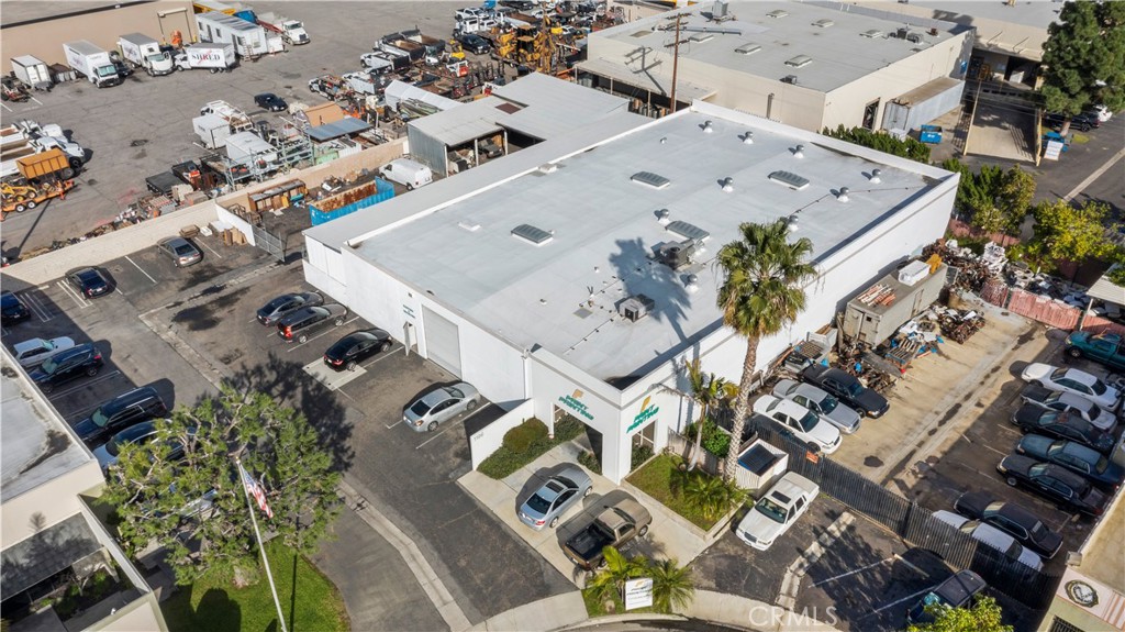 Large industrial building over 10,000 SQFT located at end of cul-de-sac on a lot over 24,300 SQFT. Located off the 91 & N Tustin Ave Between the 55 & 57. Great location in this micro industrial area. There are 3 offices, restrooms plus huge warehouse area with 2 very tall bay roll-up doors. Great potential for all kinds of businesses. Single story on a flat lot with very high warehouse ceilings. 12 parking stalls along the building sidewall and rear brick fence line. Additional backside gated parking/storage with open and high covered canopies located at the backside. Warehouse may accommodate vehicles in addition to large equipment. Lease terms offered 5 - 10 years with a low rate of only $1.50 SQFT plus NNN of only $0.08 SQFT.