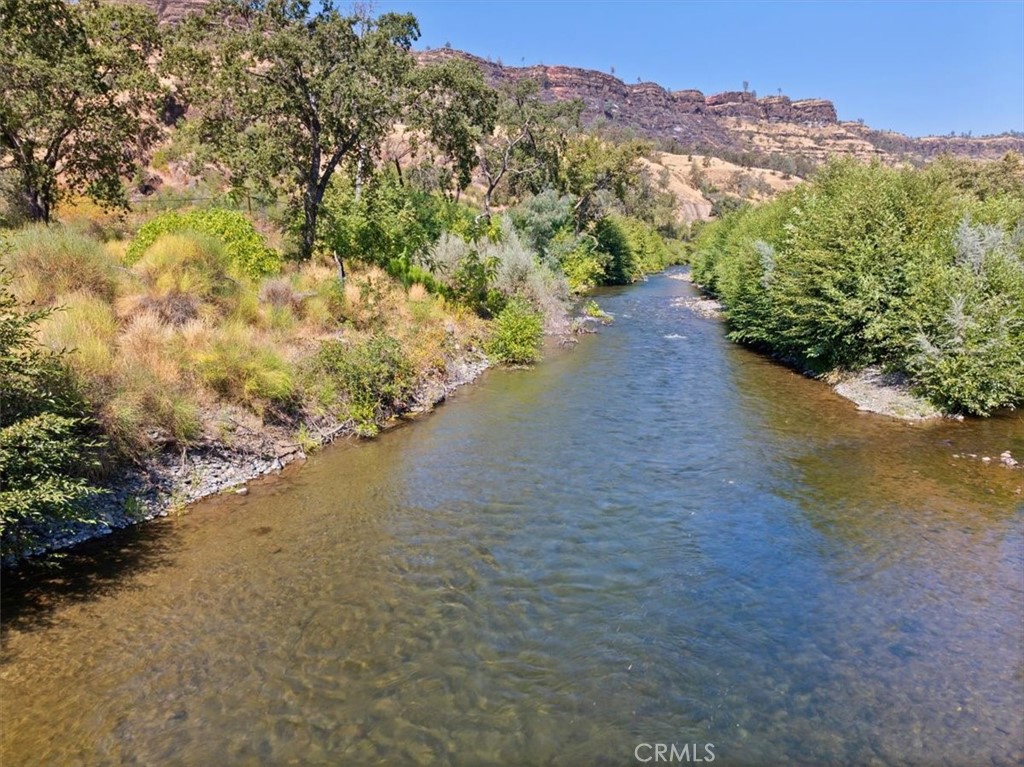 Rarely available Butte Creek Property. This breathtaking property spans almost 5 acres of creek frontage. Only 15 minutes from Chico and a short walk to the covered bridge this property is the opportunity to build your dream house. The property previously had a 4/3 bath house 2183 sq ft. There is septic and well and power already to the property. The property has 2 gated entrances from Centerville Rd. A rip rap retaining wall was completed post campfire. Bring all offers