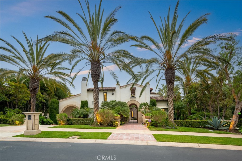 Nestled serenely on the front row, this extraordinary estate commands an elevated position, gifting panoramic vistas that stretch across the expanse of the Pelican Hill Golf Club and beyond, where the azure ocean meets the sky. Encompassing over 7,900 square feet of opulent living space, this residence is a testament to boundless luxury with a distinctive coastal essence. Set within the prestigious confines of an around-the-clock guard-gated community, this property ensures the utmost privacy and security. Adding to the allure is the convenience of an elevator, seamlessly connecting all three levels of the residence. A picturesque embodiment of resort-style living, the custom design of this remarkable home encompasses 5 lavish Bedrooms, 7 Full Bathrooms, and 2 Half Bathrooms. The grandeur is accentuated by the presence of a separate front casita, offering privacy and versatility. A tranquil private courtyard welcomes you, setting the tone for the lavish experience within. The outdoor expanse unveils an oasis of relaxation, complete with a glistening pool, an invigorating spa, and a barbecue area where al fresco dining is an art form. The sweeping views of the golf course merging with the vast ocean create an ever-changing backdrop, enriching each moment spent here. This residence is a symphony of indulgence, exemplified by its offerings of a subterranean 6-car parking garage spanning 1,300 square feet, an upper-level direct access 2-car garage, a wine room for connoisseurs, an intimate theater for cinematic experiences, a well-equipped gym for wellness pursuits, and a soothing sauna for moments of respite. Drawing inspiration from the famed architect Wallace Neff, the residence exudes an air of timeless elegance. Graceful archways and hand-carved beam ceilings adorn the interior, while hand-fired terra cotta flooring graces the floors, each element meticulously chosen to define luxury living. Set within the renowned 504-acre enclave of Pelican Hill®, this home enjoys privileged access to a world of unrivaled coastal beauty. A sanctuary of privacy and seclusion, this community is a testament to refined living, offering a retreat where family and friends gather to create lasting memories. Seize the opportunity to live amidst architectural excellence, surrounded by lush landscaping, and awaken each day to unparalleled vistas. This estate represents the epitome of luxury living, where classic sophistication meets the tranquil allure of coastal living.