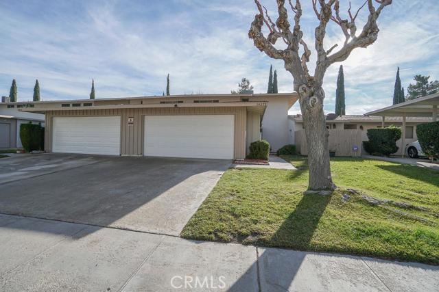 Cozy Condo with Modern Colors and Finishes. Tucked into a High Privacy Pocket. Back Yard has a Nice View of Golf Course Equipped with a Deck from the Master Bedroom. Garage and Laundry Room are separated from the Living Quarters. Layout is Spaced Out Nicely for Square Footage. Feels nothing like a Home Built in 1963. Association Amenities: None # of RV Spaces: 0NONE Lot Location Type: On Golf Course Patio and Porch Features: Balcony Special Features: None Basement: FINI # of Attached Spaces: 0 # of Detached Spaces: 2