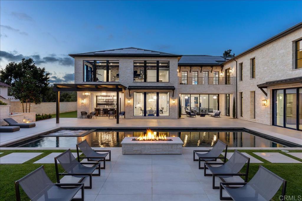 ~Reprieve~ Impeccable design & scale in this Newly Built 2022 Modern Estate. Offering elevated living with exquisite bespoke designer finishes that include an architectural floating staircase & adjacent custom walnut elevator to the second level. Large format Italian flooring & European white oak floors, seamless glass wine storage floor to ceiling, backlit exotic Onyx bar, His & Her private offices, 5 star resort Gym / Wellness Center, Pool/Spa with basalt stone waterline that looks like a glass top. Sliding doors create a seamless confluence from indoor/outdoors. The ultimate Master suite offers unobstructed VIEWS & total privacy. The master bath is a true spa destination and offers two custom boutique closets and an open relaxation area. The quality throughout is beyond compare with total sound proofing from second floor, slate roof, owned SOLAR, 5-Car Garage, retractable outdoor TV, firepit, upper yard, fruit trees to a full Sports Court.