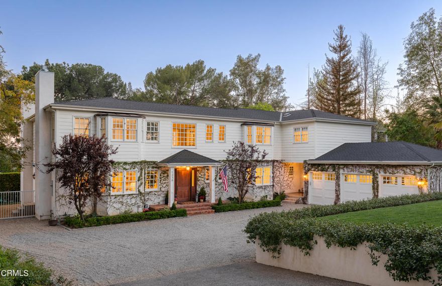 Nestled on a peaceful cul-de-sac in La Canada Flintridge, this stately East Coast home is a true masterpiece and entertainer's dream. Boasting an impressive 6,000 square feet (measured 6,150) of luxurious living space, this grand custom-built estate features six spacious bedrooms, five and a half bathrooms, and a host of upscale amenities and details that are sure to impress. Upon entering the home, you are greeted by a stunning two-story foyer with striking natural light. The home's well-appointed gourmet kitchen is a chef's delight featuring top-of-the-line appliances, custom cabinetry, and a spacious island and countertops offering ample space for meal preparation and opens to a spacious family room providing the perfect space for entertaining and casual family gatherings. For more formal gatherings there is a separate dining room which can comfortably accommodate large gatherings and dinner parties and features a +500-bottle climate-controlled wine cellar. The east wing of the home features a formal living room and fireplace and flows into a beautiful and newly completed study with an elegant bar area and second fireplace perfect for enjoying a nightcap with friends or curling up with a good book. Upstairs, the expansive primary suite is a true retreat, featuring nearly 800 square feet and ten-foot ceilings, it boasts a luxurious en suite bathroom with soaking tub, dual vanities, a large walk-in shower, and his and her closets. The remaining five bedrooms are also generously sized, offering ample space for guests or a growing family. The outdoor space of this stunning estate is just as impressive as the interior, featuring a large grass area perfect for outdoor activities and games, an expansive partially covered outdoor patio, and a sparkling pool ideal for relaxing on summer days. With its prime location in the highly coveted La Canada Elementary school district and its stunning array of luxurious amenities, this stately home is the perfect choice for those who demand the best in luxury living.