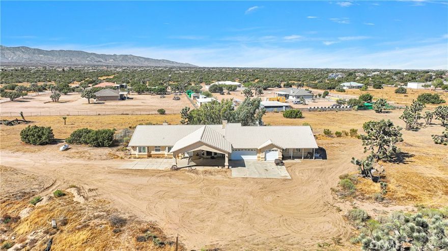 Welcome to Oak Hills!  This amazing property is convenientely located just minutes from Hwy 395 and Hwy 15!  The home features not one, but 2 living rooms, 4 bedrooms and 3 bathrooms.  The garage is split with over 1,100+/- sq. ft. of an OVERSIZED 3 car garage and a workshop attached to the home!!  The workshop also has a bathroom inside!  This home sits on almost 10 ACRES of land FULLY FENCED!  ENJOY MAJESTIC VIEWS!  AMAZING SUNSETS AND SUNRISES!  Don't miss out!