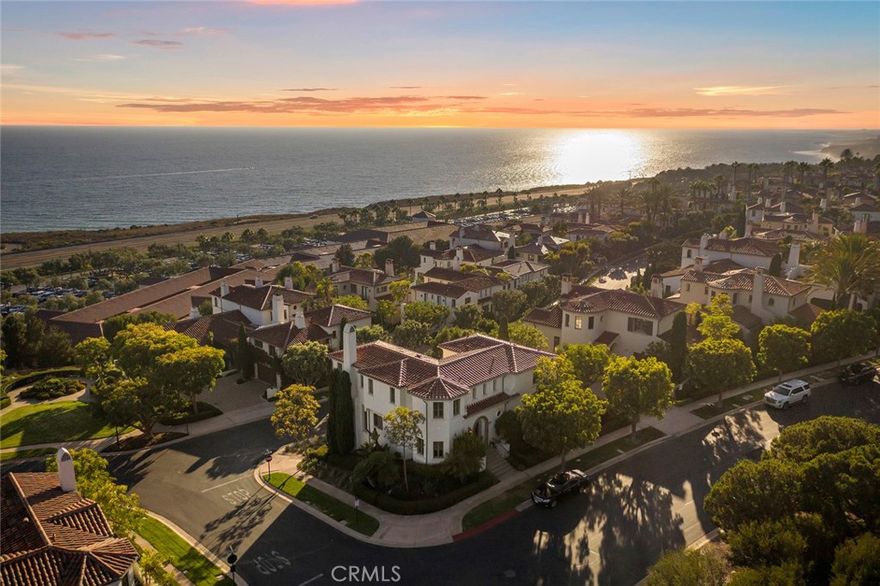Set on a hillside in Crystal Cove’s Seascape neighborhood, this residence represents the best of luxury beach living.  An unparalleled location so close to the Pacific Ocean that you can see waves cresting before crashing onto the white sand beaches, just a short walk beyond the private gates of Crystal Cove. One of only a handful of 86 villas that’s completely detached and freestanding, this residence is perched on a coveted elevated corner lot, offering exquisite privacy and phenomenal white water and Catalina views. A well-designed floor plan creates a real connection to the natural landscape, with ocean views found in almost every room of a villa that spans 2,849 +/- s.f., with 4 bedrooms and 4 bathrooms. A large sun terrace enclosed by glass panels is a place to entertain while watching the sun dip below the horizon, this space seamlessly links with two bright & airy living spaces; a living room with a wall of ocean-facing windows and a fireplace, and a dining room with elevated ceilings and polished stone floors. The kitchen features an archway that frames an ever-changing view of blue waters, and offers an 8-burner Viking range w/griddle & dual ovens, a SubZero refrigerator, and a quiet breakfast room with built-in cabinets and tray ceilings. The main floor is completed by a powder room, and a bedroom suite that offers the potential for a private guest space or an office away from the rest of the house. On the upper level, a primary suite boasts a balcony with French doors that offer panoramic views that stretch across rolling ocean swells to Palos Verdes, and an ensuite that offers separate vanities with stone countertops, a travertine tiled shower, soaking tub, and dual walk-in closets. Two additional bedrooms have plantation shutters and are linked by a shared bathroom, as well as a shared deck that’s perfect for gazing at the nighttime sky. Additional features include a paver stone driveway that accesses a 2-car garage, built-in audio, and a convenient upstairs laundry room. Crystal Cove is a 24-hour guard-gated community that offers residents access to scheduled social events at the Canyon Club, as well as a Junior Olympic pool, wading pool, and gym & sports courts.The best of Crystal Cove includes fine dining, casual eateries & eclectic boutiques at the Promenade, charming historic beach cottages & the iconic Beachcomber, and the white sand beaches that are all within a short stroll.