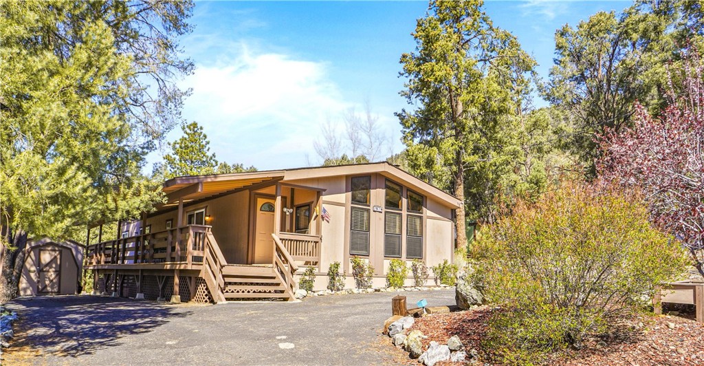 ** Seller is motivated! ** Nestled in the heart of the majestic Los Padres National Forest, this 2-bedroom, 2-bathroom manufactured home offers an unparalleled lifestyle with 180-degree panoramic views of Mt. Pinos. Perched just high enough to gaze over the neighborhood and surrounding mountains, this 1,344 sq. ft. single-level retreat has no space rent, just pure ownership. Built in 1981, it qualifies for a mobile home loan.
Step into open-concept living where a spacious living-dining area welcomes you with soaring high ceilings and a cozy fireplace, perfect for warming up on crisp mountain evenings. The partially open kitchen features a charming breakfast bar, ideal for casual chats while whipping up culinary delights. Down the hall, discover a well-appointed guest bedroom, a full guest bathroom, and a serene master suite with a beautifully renovated bathroom for ultimate relaxation.
Practicality meets comfort with a sizeable laundry/mudroom, a covered expansive deck perfect for snowy days, and a circular driveway offering ample parking for guests. The deck’s covering extends to shield parking spaces, and a South facing driveway, ensuring convenience year-round. A secure storage building connects to a shed to provide ample space for tools and outdoor gear.
This meticulously maintained home is ready for its new owners, blending modern comforts with the tranquility of nature. With no detail overlooked and priced to sell, this Mt. Pinos gem is your chance to own a slice of paradise in one of California’s most breathtaking landscapes.
Owners are granted membership into the Pine Mountain Club Property Owners Association which offers a myriad of benefits including an Olympic sized lap pool, Summer Concerts on the Greens, an impressive Equestrian Center, recreation fields, Tennis/Pickleball courts, a 9 hole PGA golf course, Clubhouse/Sports bar, and 24 hour private Security! Just 30 mins from the planned Hard Rock Casino in Mettler, 90 mins to downtown LA, and under 2 hours to Ventura county beaches!