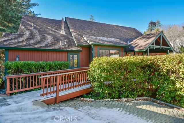 **SOLD before print*** This spacious home is in the Voltaire neighborhood & walking distance to the lake & Tavern Bay. Plenty of space for the whole family with additional family room! Beautiful tongue & groove ceilings with dramatic rock fireplace. Seasonal stream behind the house that backs up to the National forest. Lake rights, garage, A/C, trex decking, this house has everything! Immaculate and well cared for.