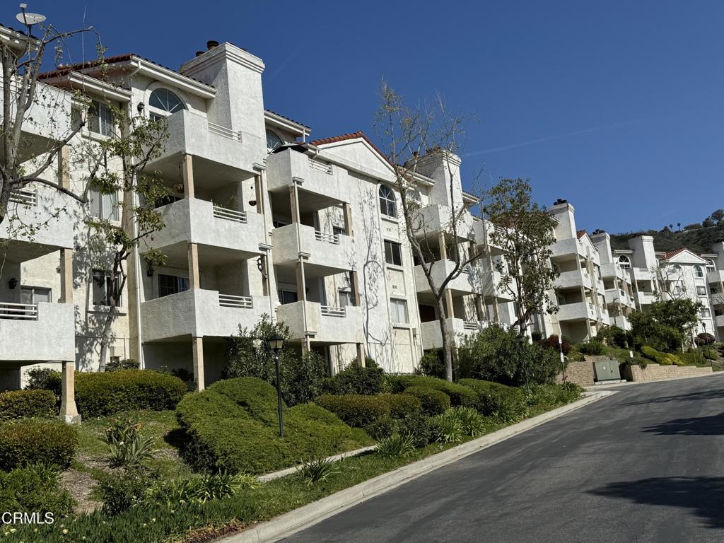 Spacious and bright, this 2-bedroom, 2-bath condo offers an oversized open floorplan perfect for comfortable living and entertaining. Enjoy a cozy fireplace in the living room, a dedicated dining area, and the convenience of a private laundry room. The unit has no interior stairs, and an HOA-maintained elevator provides easy access--ideal for all ages and lifestyles. Step out onto your private balcony and take in the beautiful hillside views of tranquil Camarillo. A private detached 2-car garage adds even more convenience and storage. The well-maintained community offers resort-style amenities, including a relaxing pool and spa, champion tennis courts, RV parking, and a community playground for the little ones. Ideally located just 40 minutes from The Valley or Montecito, this is one of the last truly affordable condos in Camarillo--don't miss your chance to own in this sought-after neighborhood!