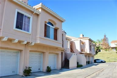 FANTASTIC GROUND LEVEL ONE story condo in sought after COSTA BRAVA development of Rancho Niguel. Hardwood and laminate floors throughout. ONE car direct garage access plus a CARPORT for a second car. Property has been repiped. Fantastic quiet interior location close to community pool. High vaulted ceilings, views of the pool area. There is a large fireplace with natural stone surround in the living room, spacious dining area, and large master suite.Nice private patio area. Easy walking distance to the Laguna Niguel Regional Park and Regional Lake. Easy access to the freeways and transportation corridor. Close to major shopping, entertainment centers and Salt Creek Beach. Fabulous location.