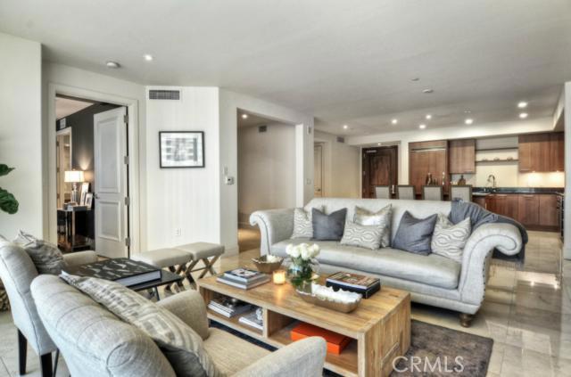 Experience luxury living in this exquisite interior unit located at the premiere high-rise building in Orange County! This stunning one story condo boasts designer upgrades including: a chef’s ‘delight’ gourmet kitchen with Italian cabinetry, stainless steel Viking appliances, granite counters, and large center island. This bright, open unit is perfect for entertaining with sliding doors that expand the living space onto a spacious, private deck. Upgrades include gorgeous Marble flooring, a spacious master suite with a huge, over sized walk-in closet. This property also offers modern designer lighting, window coverings and fireplace. Property has 2 subterranean parking spaces, with elevator access and The Plaza Irvine Community offers exceptional amenities including concierge services, 24-hour lobby attendant, resort-like pools & spa with private cabanas, state of the art fitness center, business center, conference room & club rooms . Close to all major freeways, UCI Campus, Irvine's business centers, John Wayne airport and Newport Coast.