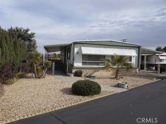 This is a 1970 Barrington home with 2 bedrooms and 2 baths and den for a total of 1440 sq. ft. This well maintained home has laminate flooring, newer carpeting, some storm windows, central heat and air and window evap cooler. There is 10'x10' storage shed with electric. The kitchen features real oak cabinets, newer cooktop, slid out shelving and laminate flooring. The formal dining area has built in hutch also with laminate flooring. The master bedroom is spacious with double closets, a dressing area and window evaporative cooler. There is a covered front deck and easy maintenance landscaping with rock scape, bushes and palms and chain link fencing. Handicap ramp at carport for easy access to rear door. This is a very clean senior park with low rent of approx. $425 per month. Lots of park amenities. # of RV Spaces: 0 Special Features: Cable TV, Storage ShedFRON,REAR Lot Location Type: Standard Location FireplaceFeatures: None Zoning: Residential 1 # of Attached Spaces: 0 # of Detached Spaces: 0 # of RV Spaces: 0