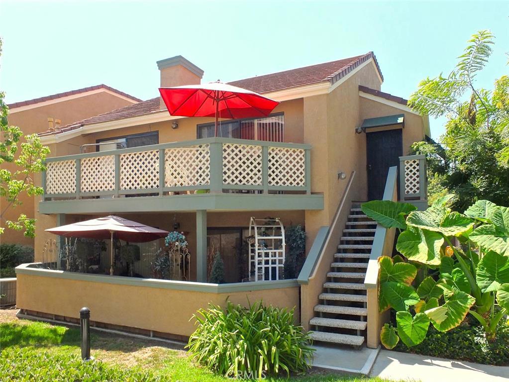Located in the Evergreen Village complex. This upper level end-unit features one bedroom and one full bath. Living room with fireplace, vaulted ceilings, and sliding glass doors to balcony. Kitchen with breakfast counter/bar overlooking living room. Separate dining room area with ceiling fan. Bedroom features a sliding door to balcony as well with plantation shutters, ceiling fan, dressing area, and a walk-in closet with custom built-ins. There is also inside side-by-side laundry. This unit also comes with a one car garage and one carport. Air conditioning and forced air heating. Complex features pools, spas, pet walk-way, landscaped walk-ways/greenbelt areas and guest parking. Located near Cypress Community College, Knotts Berry Farm, shopping and dining.