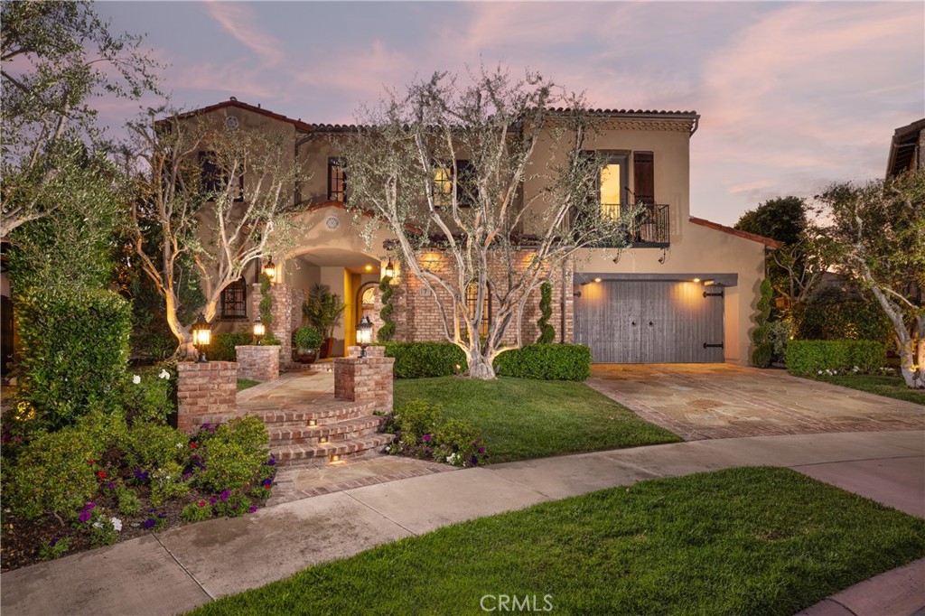 Move up to refined luxury living at this custom-upgraded Newport Coast residence, located behind the guarded gates of the exclusive Pacific Ridge community. This elevated cul-de-sac homesite of nearly 9,805 SF offers sublime ocean, hill, and canyon views, just moments from outdoor trails and hikes to the ocean.
Natural light dazzles indoors through multiple French doors, illuminating a two-story floor plan of approximately 5,194 SF that seamlessly integrates the living, dining, and kitchen areas. Perfect for memorable entertaining, the entryway opens to a seating area and a formal dining room featuring an enclosed wine cellar. The main level includes an en suite bedroom with French doors to the backyard and a steam shower—perfect for overnight guests—and an expansive office/bonus room with an attached bathroom, which could serve as the fifth bedroom.
Showcasing an open design, the living room is equipped with a fireplace, high ceilings, elegant hardwood flooring, and a seamless flow to the kitchen. Anchored by a large granite-topped island with bar seating, the chef-inspired kitchen boasts top-of-the-line stainless steel appliances, including Wolf and SubZero, custom cabinetry, and a spacious walk-in pantry. The adjacent dining area is perfect for cherished meals and gatherings.
The owner's suite offers a plush escape with a luxurious en suite bathroom featuring a separate walk-in shower, double vanities, jetted soaking tub, and walk-in closet. Further along, there is a fully equipped laundry room, two secondary en suite bedrooms, and a secondary living room in this wing of the home, which opens to the expansive patio/deck for spectacular sunsets and has separate stairs to the backyard below.
Outdoor living is equally impressive, with a beautifully landscaped backyard that includes a saltwater pool, spa, fire pit, BBQ patio area perfect for alfresco dining, lush lawn, and mature trees for privacy and tranquility. Additional highlights include a newer tankless water heater, security system with cameras, putting green, speaker system throughout, and attached three-car garage.
Pacific Ridge offers a 24-hour guard gate entrance, an Olympic-size heated pool, heated spa, toddler pool, two large barbecues, playgrounds, a grassy area with a grand fireplace, and direct access to amenity-rich Coastal Peak Park. Set minutes away from pristine beaches, upscale shopping, fine dining, and top-rated schools, this residence is the epitome of luxury living.