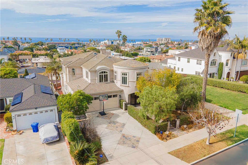 Price Reduced. This home is located on a quiet street with breathtaking ocean views stretching from Palos Verdes to Malibu, this custom-built resort-style home offers the perfect blend of luxury and tranquility. Built in 2000, this expansive property boasts over 5,100 sq. ft. of living space, featuring 6 bedrooms and 5 baths. Enjoy the ultimate Southern California lifestyle with a saltwater pool, jacuzzi, and slide, perfect for relaxation and entertaining. The grand entry of this home leads you up to the spacious, open-concept living area, including a living room, dining room, and gourmet kitchen complete with stainless steel appliances, a large island, and walk-in pantry. From the top-level living area, the panoramic views offer unparalleled serenity. The main level includes the large primary suite with balcony access, 3 additional bedrooms, a laundry room, and direct access to the garage. The lower level presents a private 2-bedroom suite complete with its own kitchen, bathroom, and family room, or game room, off of the pool area that can also be ideal for guests, multi-generational living, or a potential rental opportunity. With stunning coastal views, top-rated schools, and proximity to the beach and local eateries, this exceptional home is a rare opportunity to experience the best of California coastal living.