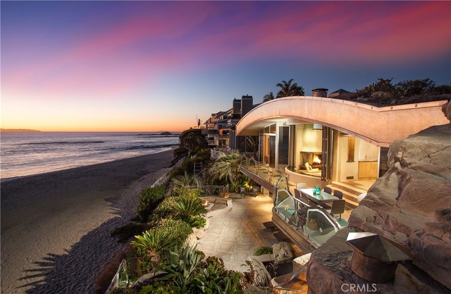 Landmark hideaway “The Rock”.Oceanfront Home  Located on the sand of Aliso Creek Beach,reflecting the culmination of 2 decades and the vision of Architect Brion Jeannette.Rarely does the opportunity arise to own a unique and one of a kind portfolio property.Carved out of the Aliso Creek Beach boulder,certified ‘green’ home offers natural protection from the elements and a reinforced concrete roof with mature local plantings.The open and bright interior creates a sharp contrast,with its high ceilings, multiple fire and water features vanishing glass walls, hand made elements throughout and multiple skylights.Riveting views of the Pacific and Catalina Island are on full display through most of the 3,000' home, 800-bottle wine cellar,game room,full ba and home theater.Gourmet kitchen has all the amenities that one would expect with a center island,Terrazzo floors and high-end stainless steel appliances.Multiple terraces designed for entertaining,Rock-lined grotto,fire pit and al fresco shower.Another terrace provides a perfect venue for hosting casual get-togethers, with its built-in BBQ, wet bar and close proximity to the beach.Built with meticulous attention to detail and superior craftsmanship,the residence is comprised of glass, concrete and steel, making it a solid investment.Walk to the Montage ,The Ranch and everything Laguna has to offer,the“Rock House”is an opportunity to own an iconic,treasured piece of real estate.This experience is priceless,Come make it yours today!