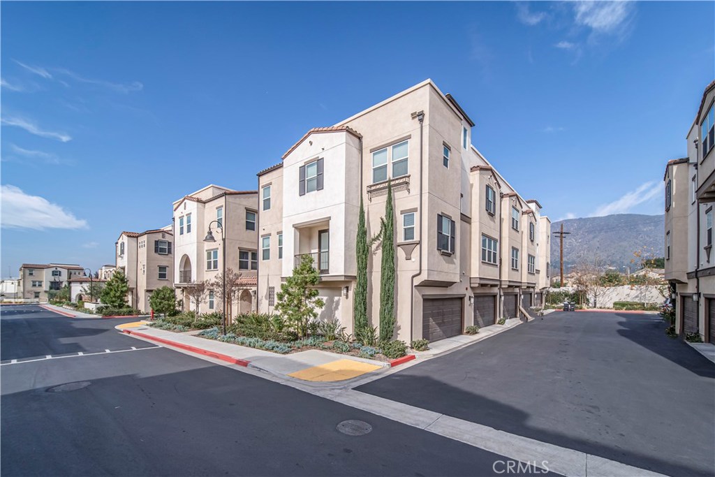 Your home search is officially over! Get ready to be impressed by this multi-level condo that boasts tons of character, charm and amenities. Its convenient and highly desired location is only the start of what this home has to offer. Ideally situated within the Award-Winning Glendora Unified School District and near several shopping centers and restaurants. Let’s take a look inside! As you enter the home, you are greeted with the den/possible 4th bedroom. The den offers a ½ bath, great lounging area and the ideal space for a private 4th bedroom or guest suite. The 2nd level highlights an open living space that you will love! Beautiful laminate wood floors run throughout the spacious living room, dining area and lovely kitchen featuring a center island, quartz countertops and stainless-steel appliances. The third level is complete with a master suite, 2 secondary bedrooms, a full hall bathroom and separate laundry area. Lounge, relax and host guests on the entertaining rooftop deck overlooking beautiful mountain and city views. This solar powered home resides in the newly constructed 2017 Glendora Foothill Collection of homes that boasts a gated entrance, pool, spa, playground, dog park, BBQ area, walking trails and PAID-OFF solar power. $239 HOA and LOW electricity costs. You will love everything about this condo! Don’t miss the chance to call this condo your new home!