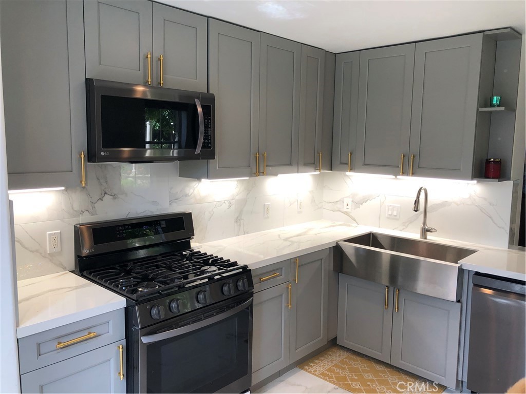 In the prestigious Watermarke Community, on the border of Irvine and Newport Beach, comes one of the very few 3-bedroom 2-bath units. The space has been fully renovated, permitted by the condo association, with no expense spared.
The unit features: brand new long-lasting bamboo flooring; a waterfall porcelain kitchen counter with 36" farm sink; porcelain kitchen floor and backsplash; upgraded LG 5-burner stove with matching stainless steel appliances; steam shower glass with rain showerhead in the bathrooms; Kohler toilets with bidet; brand new vanity cabinets with marble countertops; custom built closets; and recess lighting throughout.
The unit also features: lots of extra cabinets with beautiful gold handles for storage, Nest smartphone operated thermostat, and a cozy patio with water repellent outdoor furniture! The unit has three assigned parking spots and there are plenty of visitor's parking available. Community amenities include: three swimming pools and jacuzzis, tennis courts, basketball courts, a fully equipped fitness center, clubhouse, and theatre room. It's minutes away from UCI, Fashion Island, South Coast Plaza, John Wayne Airport, the finest beaches and restaurants in Orange County!