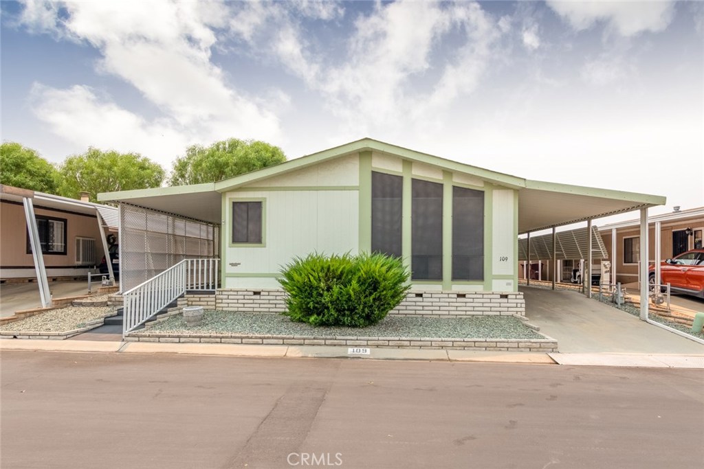 Spacious triple wide located in the desirable 55+ park known as Mountain View. This home has many wonderful features to include formal living room and dining area, family room open to the kitchen and a den. Huge indoor laundry room with lots of storage and utility sink. Carport big enough for two cars and a storage shed at the end. Enter the covered patio from the sliding glass door in the master bedroom and enjoy beautiful views of the Clubhouse, the park greens and our valley's beautiful mountains. Close to shopping and the expressway. Low park rent.