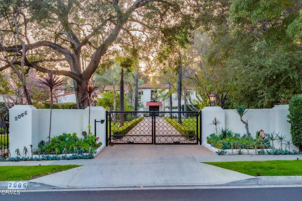 One of a kind 1.93 acre estate captures the true essence of San Marino's rich history. This enchanting Spanish Colonial Revival estate is a rare opportunity to own an extraordinary and iconic property nestled in the heart of San Marino's prestigious Oak Knoll estate neighborhood. Designed in 1925 by renowned architect Roland Coate Sr., the magnificent 1.93 acre lot offers privacy as well as accommodations for large scale entertaining.Secluded and private behind iconic lamp capped private gate, and down a long, tree-lined driveway is the grand courtyard of this stately home. The main house boasts six beautiful bedrooms with four stylish bathrooms. This romantic home features spacious rooms, gorgeous hardwood floors, carved wood doors, handmade tiles & ironwork, and numerous French doors displaying exquisite detail, craftsmanship and timeless style.This estate also offers a two bedroom, two bathroom guesthouse with an attached artist studio and a separate casita with a large, covered wrap around porch perfect for additional outdoor dining and entertaining. Additional highlights of this unique estate include a resort-style pool, lavish landscaping, meandering paths, fruit trees, expansive lawns, koi pond and beautiful gardens. This gorgeous home exudes luxury, privacy, grace and magic!