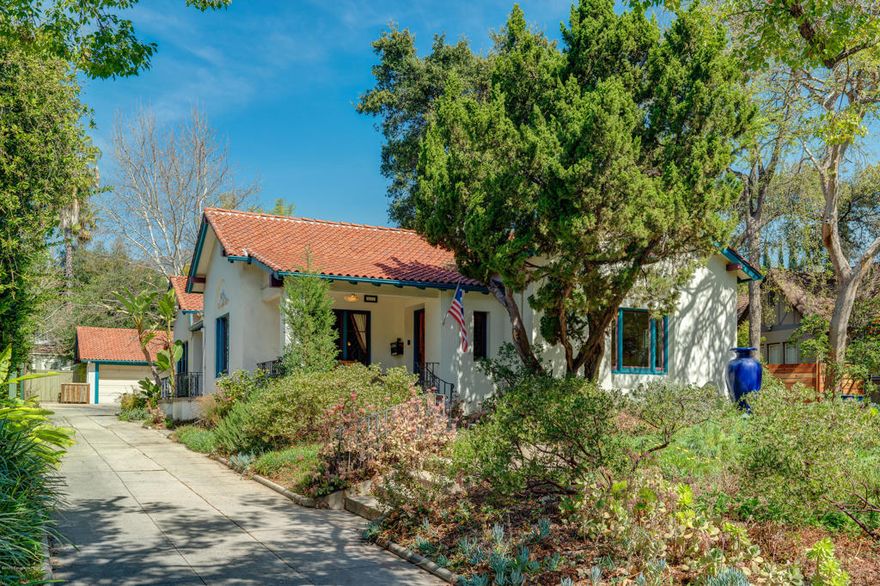 Welcome to this incredibly restored 1924 Spanish-style home that is filled with elegance & grace. The interior was remodeled, ensuring a seamless marriage of the character of the period with the modern amenities of today. The 2 bedroom home has a bonus 2nd level (507 SF) that includes 2 additional sleeping areas as well as a family room & office space. The lower level includes a welcoming living room with rich Mahogany crown moldings, an elegant fireplace & tall pocket doors that lead into the resplendent dining room, wrapped in windows, as well as reproduction William Morris wallpaper. It is exquisite! This steps into the remodeled kitchen w/ custom cabinetry, a professional grade AGA range, two sinks & an expansive center island as well as an adjoining sitting area. The 1st floor has 2 spacious bedrooms as well as two baths w/ marble counters, hex tile & refurbished hardware. There is a fantastic basement that incls a workshop & also a 'speak easy' room (302 SF) that is perfect as a hidden office or studio.The 16,163 SF lot is lushly landscaped & wraps a tranquil pool. Behind that is a verdant lawn & converted garage (488 SF), currently used as a music space, plus a bonus art or fitness studio (170 SF) . A picture-perfect piece of Pasadena history!