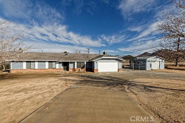 PRIDE OF OWNERSHIP! Come check out this beautiful, picture perfect home in Apple Valley. Features three large bedrooms plus a additional spacious room which could easily be used as a fourth bedroom, game room, formal living room etc. Huge kitchen with beautiful granite counter tops and tons of cupboard space which opens into the large family room with fire place. Tile floors through out most of the home. Freshly painted, carpets cleaned. Sits on over a acre of horse property. Completely fenced and crossed fenced with additional fenced private yard area. RV Carport with 30 amp hook up, lots of concrete, 3 sheds, approx 20x20, 10x20 and 12x12. Also includes a 12x20 carport in the back area of yard which is separately fenced. Fruit trees, newer heater, back covered patio to enjoy those summer barbecues, close to shopping. Much, much more! Make your appointment today for you private showing! Association Amenities: None # of RV Spaces: 0 Special Features: ,SK,SH,OBNONE Lot Location Type: Standard Location Special Features: Garage Door Opener # of Attached Spaces: 2 # of Detached Spaces: 0