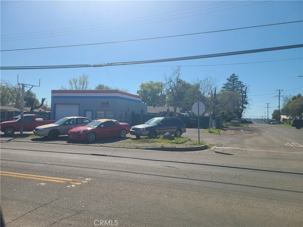 Corner commercial. Ready for occupancy. The current Business sold separate. 3 small Lots together. Completely fenced, the building very secure. Current use as a shop and office. Tow yard.