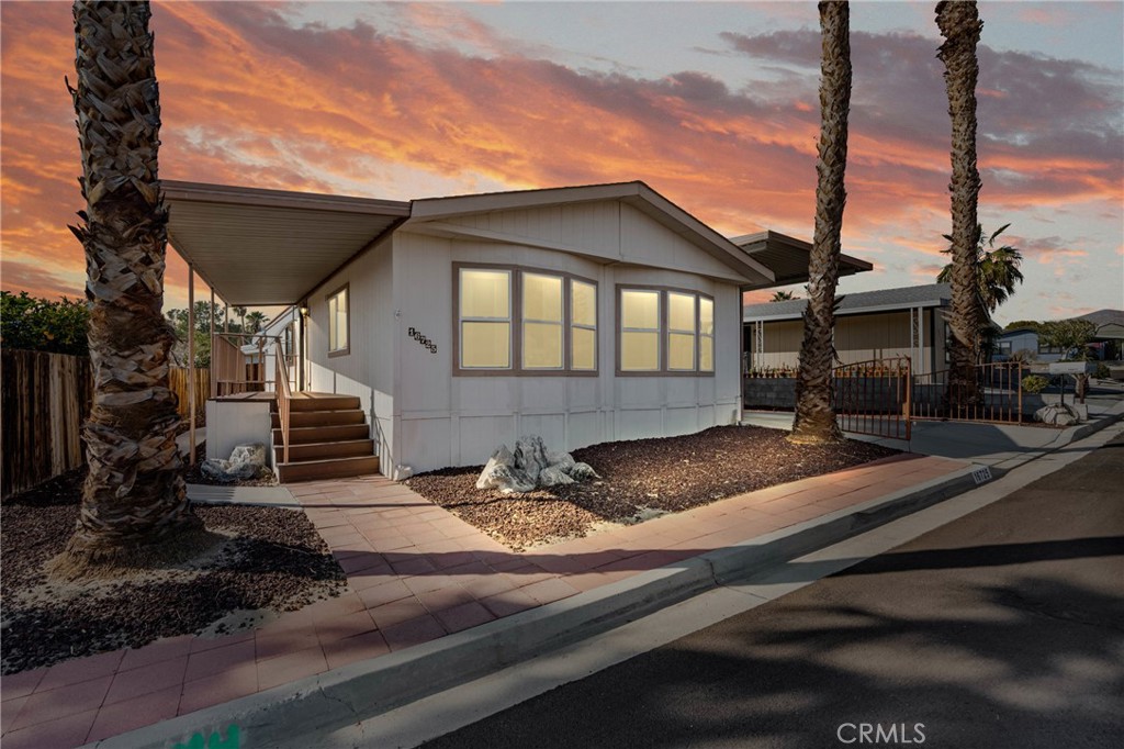 ***Welcome to Desert Crest Country Club*** Don't miss out on this incredible opportunity to own this fantastic single-story home in this great, affordable 55+ community that features Golf, Clubhouse, sparkling Pool and spa, mountain views, and more! As you approach, enjoy the tasteful curb appeal and the amazing oversided carport (one of only a few in this community), perfect to fit RV's or vehicles. Upon entry to the residence, enjoy this great floorplan that features a large open living room, separate dining area, kitchen that features plenty of cabinets and counter space as well as a double sink, updated faucet, range, vent hood, refrigerator, and a separate laundry area located just off the kitchen, including washer and dryer. The primary bedroom is generously sized and features an en-suite primary bathroom with dual sinks, soaking tub, and separate shower. Also enjoy the additional generously sized bedroom and convenient additional bathroom. Other notable features include the updated front door area deck, updated windows, outdoor shed, kitchen water filter, updated sinks and toilets, TOO MUCH TO LIST! Also enjoy all of the great amenities that this community provides. Act now, before it's too late!