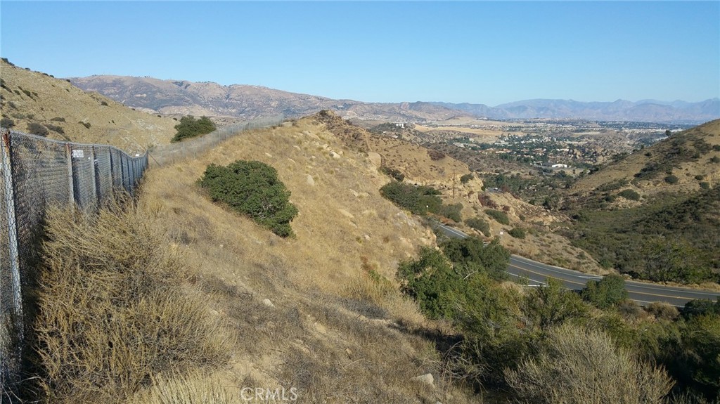 THIS IS LAND IT SITS BELOW THE 118 FREEWAY. IT IS ZONED A-2=HEAVY AGRICULTURE, IT IS APPROXIMATLEY 6,968 SQUARE FEET.