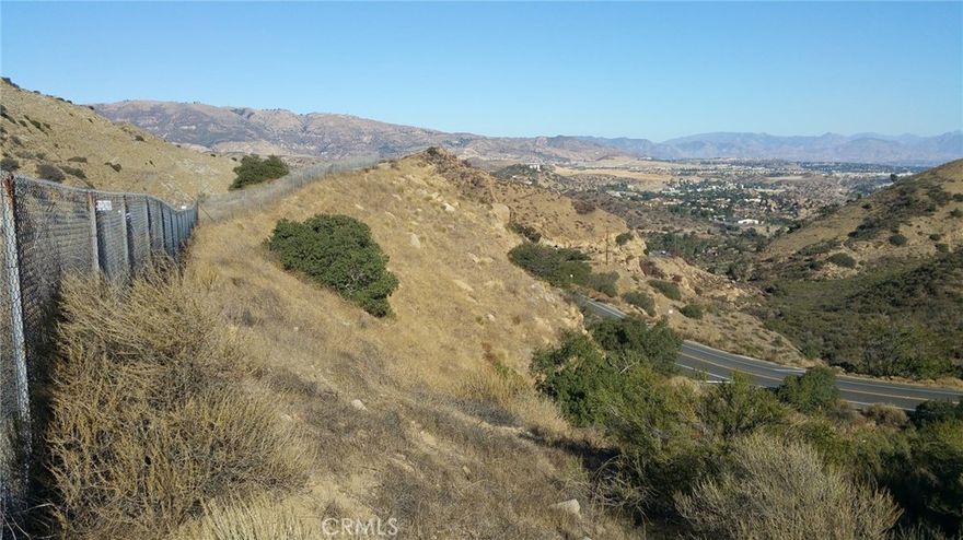 THIS IS LAND IT SITS BELOW THE 118 FREEWAY. IT IS ZONED A-2=HEAVY AGRICULTURE, IT IS APPROXIMATLEY 6,968 SQUARE FEET.