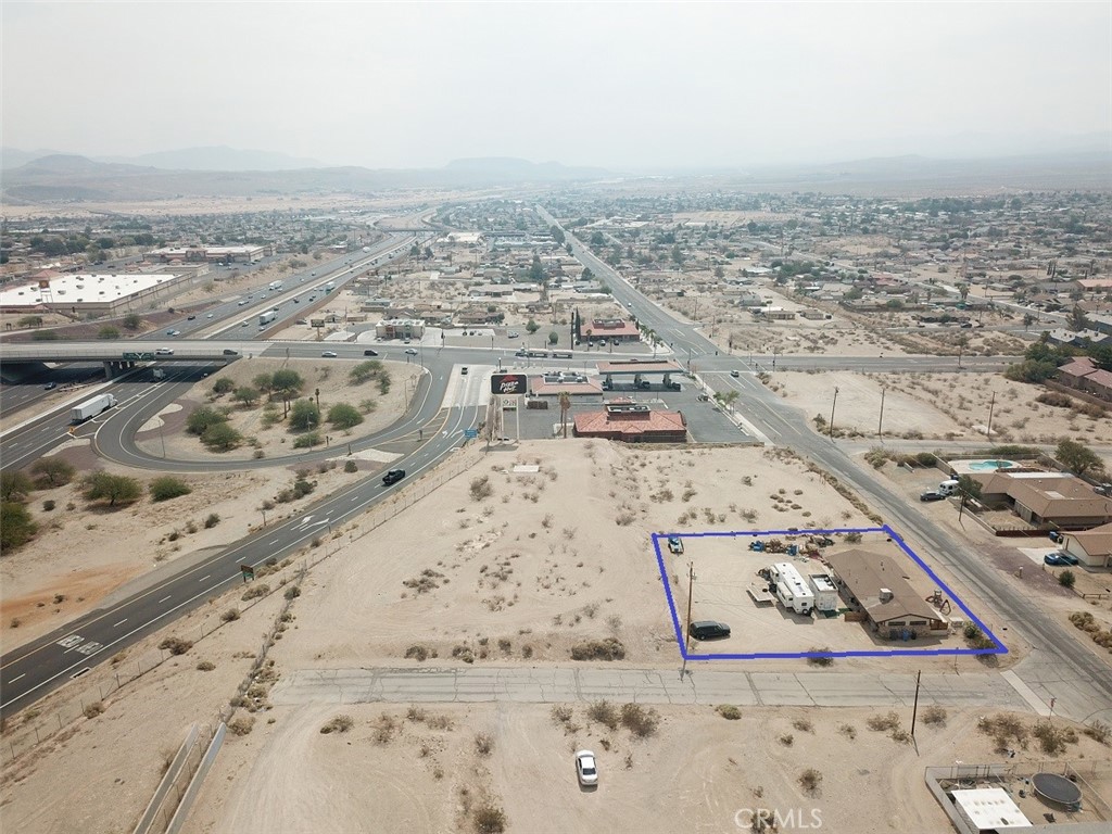 Commercial property for sale. Building size 1,270 sf. Lot 21,450 sf. Utilities (water, gas, sewer & electricity) stubbed to property. Zoned Diverse Use which allows a wide range of uses including multi-family, commercial, office, single family residential, or a combination of these uses. Great location. Freeway inter state 15 visibility. Adjacent to Pizza Hut & Valero Gas Station. A new Shell gas station under construction across from Valero. NOTE: GROUND LEASE IS AVAILABLE. BASE RENT $10,000/MONTH + NET. NOTE: ADJACENT PARCELS (1.065 acres on Sumac Court) IS also available for sale and ground lease. Total 2 parcels = 1.57 acres. NOTE: A major hub on the BNSF Southern Transcon in San Bernardino County where the Needles, Mojave and Cajon subdivisions come together, and the location of Barstow Yard, will be the site of Barstow International Gateway, a $1.5 billion investment described as a “state-of-the-art master-planned integrated rail facility, and the first being developed by a Class I railroad.