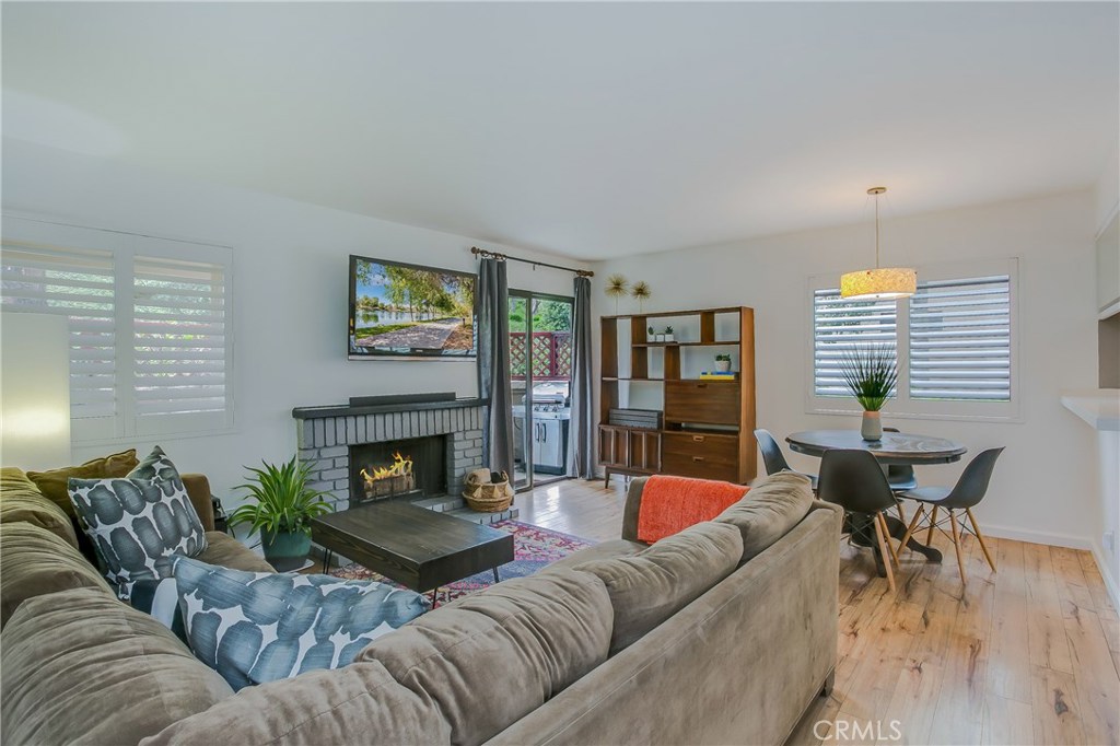 Pride of ownership in Laguna Niguel! Welcome home to this gorgeous 3 bedroom // 2 bathroom, single-level beauty conveniently located among first class shopping, dining, outdoor trails and excellent schools. Tasteful high-grade laminate floors throughout appeal to a multitude of styles and is built to withstand life with kids and pets. Freshly painted walls with lots of natural light afford a cheerful living space, while new vinyl shutters allow for privacy. The kitchen has been recently updated with bright white quartz countertops and an ultra-modern single basin sink. Each of the three bedrooms boasts plenty of closet space and neutral paint tones, while both bathrooms feature honed granite countertops and modern lighting. The unit faces the slope and greenbelt, ensuring an exclusive spot for dinners on the generously sized patio. An additional patio off the kitchen offers an excellent utility space with full size washer and dryer. Additional storage space can be found in the one car detached garage. The community has 2 pools and a clubhouse, and is just minutes away from 5 freeway and 73 toll access.