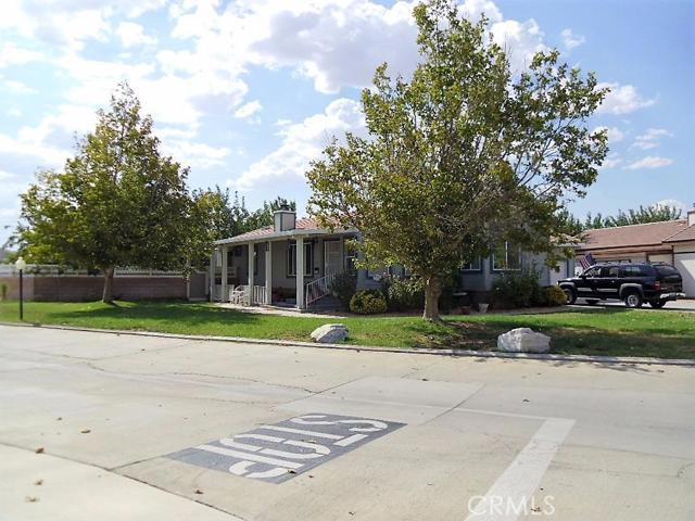 SEEING IS BELIEVING! Located in the Premier Senior Mobile Home Community in the high desert, Vista Del Rosa. 3 months free rent incentive with full price offer! This home is situated on a large, corner lot with lots of privacy and park-like setting. Perfect lot for greenhouse, garden, and plants, Mature trees and landscaping, grass front yard, privacy fenced side and rear yards with Mature trees, landscaping and Koi pond, fenced rear yard with privacy fencing, covered patio, storage shed, and more. Tile roof rated for up to 50 year life, awning full length of home on South side, brick skirting accent, 2 car attached garage and parking for 4 cars on driveway. Features include Pergo laminate teak flooring throughout except for baths which have porcelain tile, granite counter tops throughout entire home. Hardwood cabinets throughout home, stainless appliances, skylight in Master Bath, solar tube in laundry, newer furnace and AC coil, molded granite kitchen sink with filtered water, glass back splash in kitchen, custom range hood, french doors in Master bedroom opening to the private garden area, upgraded window coverings. Home has formal dining room, 2 bedrooms and a Den. This is an unusual highly upgraded and updated home that features tape & texture drywall throughout, home is in excellent condition, large indoor laundry with tons of storage, all waiting for the discriminating buyer. Close to Senior Center, shopping, hospital and all services. # of RV Spaces: 0 Special Features: Garage Door Opener, Skylight, Storage Shed, Util. UndergroundFRON,REAR,AUTS,SPRN Lot Location Type: Standard Location FireplaceFeatures: Living Room Pool Features: Common Pool Spa Features: Common Spa Zoning: Residential 1 # of Attached Spaces: 2 # of Detached Spaces: 0 # of RV Spaces: 0