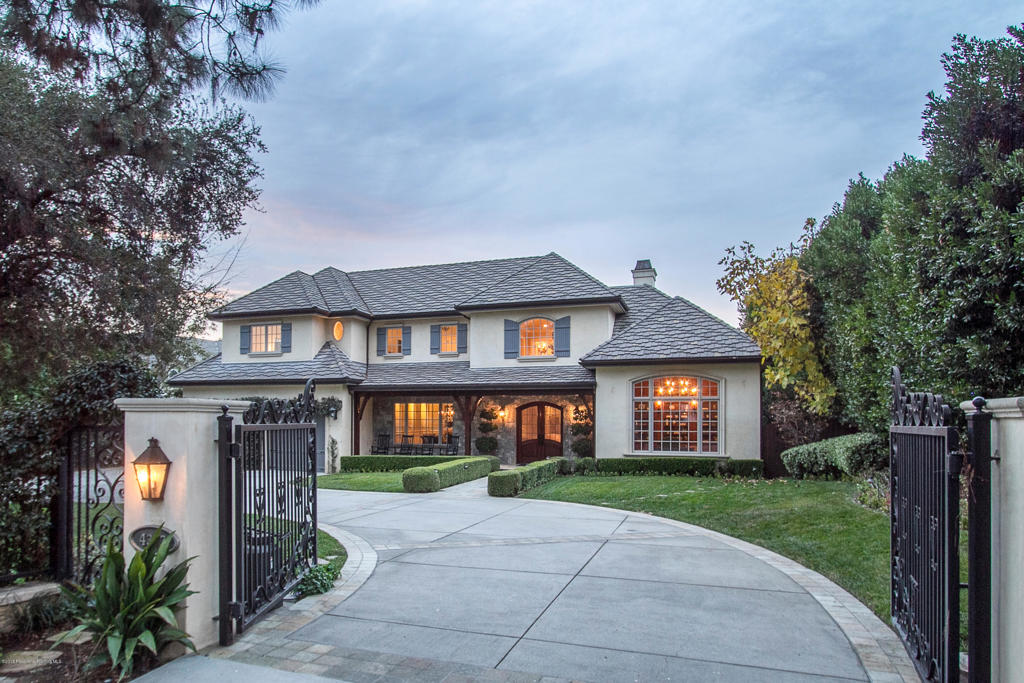 Don't miss seeing this Fabulous French Country Estate in a prime Flintridge location! This is the home you have been waiting for. Thoughtfully designed, the flowing floor plan has room for everyone! With over 8000 square feet of living space, this stunning 6 bedroom, 8 bath home offers the finest in design, materials and finishes, including 4 fireplaces, pool, spa and outdoor kitchen. Gleaming hardwood floors, light and bright throughout - spacious rooms with vaulted ceilings make this home perfect for day to day living, as well as entertaining on a grand scale. The lower level boasts an enormous game room with wet bar, full theater with plush seating, a wine cellar with tasting room and a gym with sauna; all absolutely perfect for visitors, parties or family get togethers.The Chef's Kitchen is a dream, complete with walk in pantry, office space, a butler's pantry area, wine cooler and built in ice maker and top of the line appliances. This stunning Kitchen has views to the resort like backyard and is open to the charming Family Room. This home personifies the California indoor/outdoor living experience with French doors, making for easy access to the patio with fireplace, outdoor kitchen, pool with waterslide, waterfall and ''beach'' entry. The stunning
