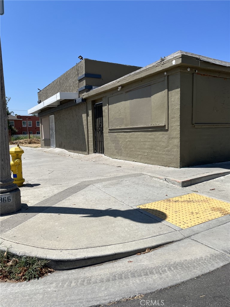 Corner lot on a high traffic street and priced to sell. Zoned commercial, many possibilities. Front building has frontage on E st. with two separate entrances. Back building is currently being used as a house of worship. There is a large paved parking area between the buildings that is fenced and gated. Please do not disturb tenant in rear unit.