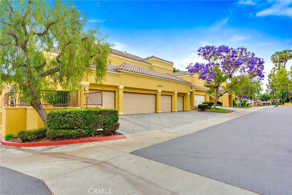 This upstairs, end unit has one of the most desirable locations in the popular Palms condominium development and just one common wall. The open floor plan and light, bright space features a living and dining area with easy access to a private balcony and seating area. The well-appointed and ultra-functional kitchen has granite counters. Each of the spacious bedrooms has its own bathroom, and the master bedroom features a large walk-in closet. The unit has its own private, one-car garage located conveniently nearby, and a parking apron in front for a second car. You’ll feel like you’re living in a resort with easy access to an attractive community pool and a recently equipped fitness center.