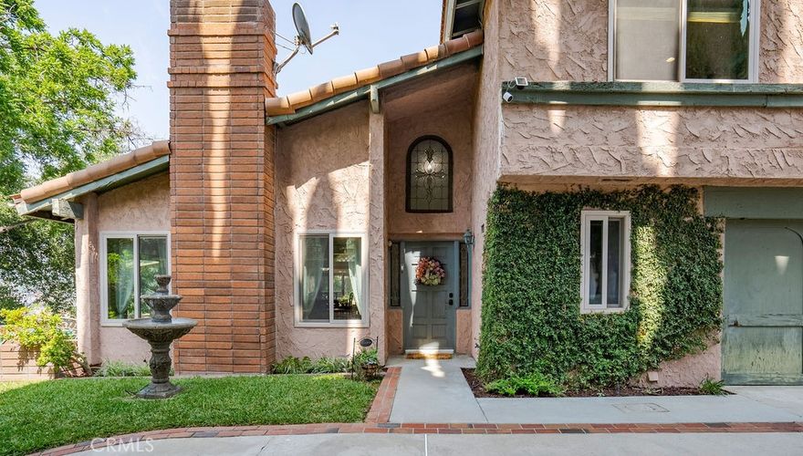 Don’t miss out on this truly unique Glendora property offering the best in privacy and panoramic mountain and city views. The 1.38 acre lot can potentially accommodate an Accessory Dwelling Unit (ADU), pool, home office, hobby shed or second garage.  As you pull into the private street, leaving behind the hustle and bustle of ordinary life, the lush landscape on either side of the driveway leads you to a concrete parking area with enough room for several cars to park or enough room for kids to play. The 3 bedroom, 2.5 bathroom home is built on a promontory, which affords you 270 degree views from three yard spaces around the home.  The views are just as amazing from inside the house - the first floor has views from the bonus room, kitchen, sunroom, living room and dining area. On the second floor, the view continue to the master suite (including the walk-in closet) and hallway bathroom. After entering the home through the front door, you’ll appreciate the open floor plan, complete with vaulted ceilings and a large set of sliding glass doors leading from the living room to the side yard patio. There is a convenient guest bathroom tucked into the corner of the first floor, next to direct entry into the two-car garage. (The separate laundry room is accessed from the garage.) The sunroom, adjacent to the kitchen, is a wonderful place to relax. The bonus room next to the kitchen can be used a as second bedroom and has its own set of sliding glass doors. Continuing through the house by walking up the stairs, the second floor features the master suite (bedroom, huge walk-in closet and master bathroom), hallway bathroom and two additional spacious bedrooms with laminate flooring. The master bedroom’s balcony overlooks the backyard. The Milgard sliding glass doors and windows throughout allow a wonderful cross breeze throughout the house and makes it easy to entertain during large get togethers. And although it is situated at the end of a private road, the nearby 210 and 57 freeways make this property commute friendly. A few minutes’ drive away are the shops and restaurants on Foothill Blvd, the quaint Glendora Village and Costco.  Enjoy the benefits of Glendora’s highly rated school district.  With so many wonderful features, this is your chance to create the home of your dreams!