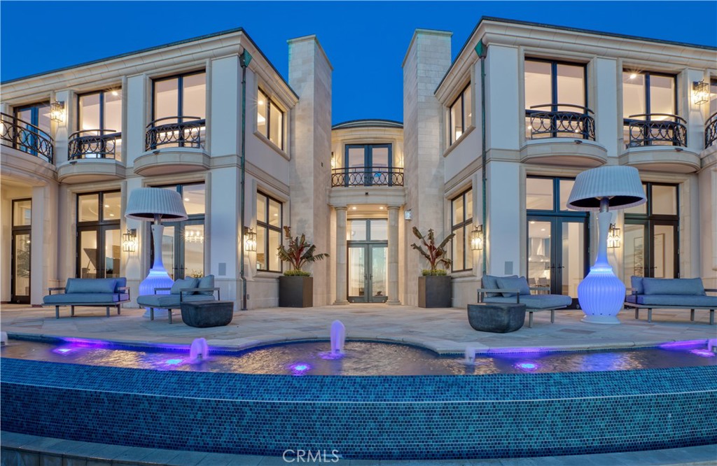 PANORAMIC "UNBLOCKABLE" OCEAN VIEWS FROM EVERY LEVEL!!! As you cruise along the easy curves of Via Coronel, climbing higher along the Palos Verdes hillside, the vivid contrast of lush green against blue sea comes clearer into view. At one of the street’s highest points a gated entrance leads onto a tidy circular driveway with old-growth trees and shapely green hedges. Welcome to 1724 Via Coronel, a Panoramic Ocean View European-styled estate that’s been thoughtfully refreshed to support an elegant mode of coastal living. At approximately 11,000-plus square feet, this masterpiece spans 6 bedrooms, 7.5 bathrooms and is positioned on a high-altitude lot that’s been as lavishly considered as its grand, sun-splashed interior. A tennis court and a resort-style pool deck with a bubbling spa and outdoor kitchen are among the highlights; so too is the ocean view fountain system inspired by the elaborate fountains at Bellagio. There are manicured green spaces too, designed for playing games on the lawn or quiet meetings over sun-soaked sunsets. So neatly linked are the outdoor spaces with the home’s interior, there seems to be little division between the two. Styled in the vein of European sophistication, the three-story residence is generously scaled and equipped with architectural markers of traditional luxury. There’s a grand entrance stretching 30 feet skyward that’s centered by a gold rotunda, filling the crisp interior with natural light and introducing the opulence of home. Floors of finely grained wood, set in a classic chevron pattern, contrast against sunlit white walls, and the home’s airy spaces are set apart by graceful archways and regal columns. Prime gathering spaces—like the refined salon where flames flicker in the gleaming stone fireplace; or the deep-teal study, where you can enjoy a favorite book beneath the classic, coffered ceiling. Dining spaces are free-flowing and modern, from a formal dining room that neatly adjoins the welcoming, sunlit kitchen that’s decked in gleaming appliances. Smoothly as the home flows for everyday family life, it also neatly shape-shifts into a versatile entertaining home. There’s a near-endless selection of spaces—from spacious, elegant configurations where one can host a fresh-air fête for hundreds, to kid-friendly and contemporary areas, like the tech-savvy theater or the plush arcade stocked with classic video games. Not to miss is the tranquil cedar sauna, gym, yoga studio or the brick lined wine cellar.