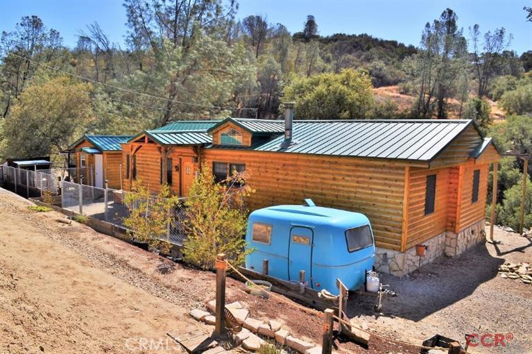 Tales of the Old West at Twin Peaks Ranch. Beautiful 3/2 MH w/ granny unit. No detail overlooked..Log & stone siding, custom trim throughout created from pine logs recovered w/i the property, custom built fixtures & decor. Vaulted ceilings, private m. suite w/ walk-in closet, wine barrel sink in m. bath, bamboo floors in guest rooms, wood burning stove w/ stone hearth in living room, old wagon singletree dining room chandelier, French doors to back deck/yard, & emergency generator. Situated throughout the ranch, you'll find the detached granny unit, 2 small cabins complete w/ solar power & wood burning stoves. Wander to the life-sized old western town complete w/ saloon, cantina, leather shop, livery, land office, & more clad w/ real late 1800's wood siding & hand troweled stucco. Addtl features incl. rifle/trap range, several storage sheds, new greenhouse, seasonal creek, natural springs, & incredible views of the Sapaque Valley, Santa Lucia mountains, & star-filled sky. A must see!