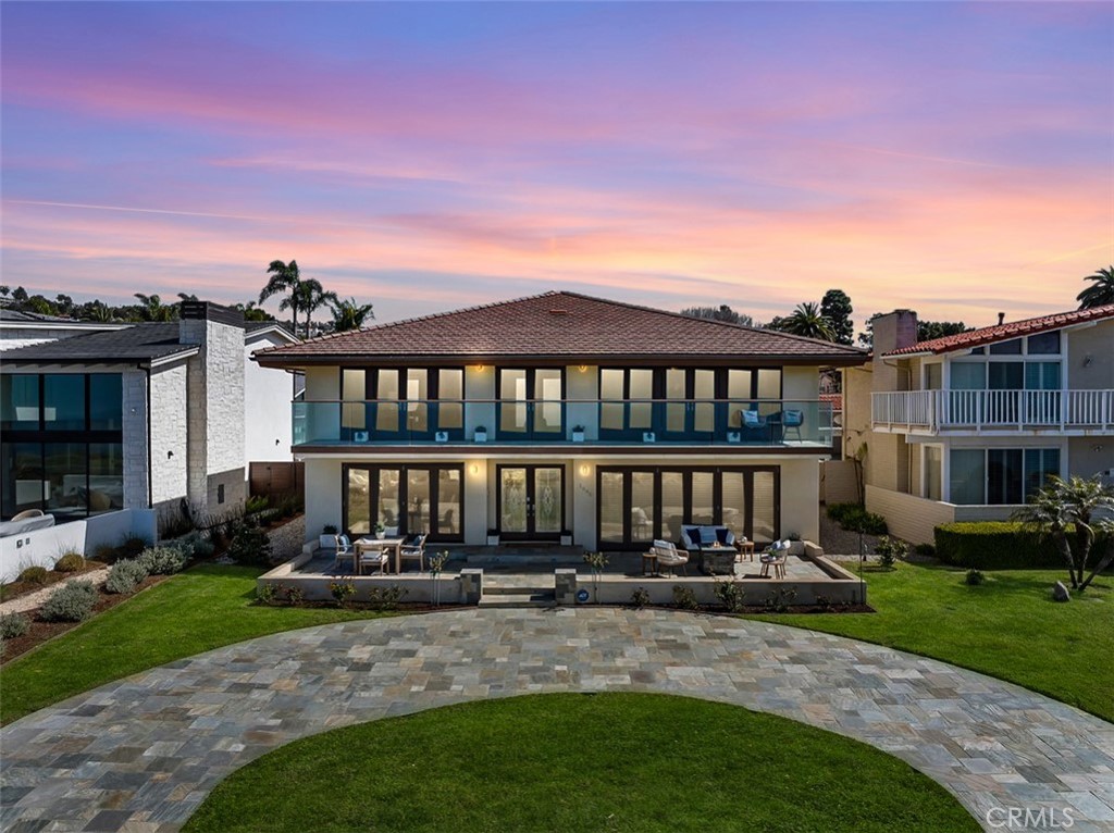 Nestled along the most prestigious street in Palos Verdes Estates, this remarkable residence enjoys an unrivaled location directly across from the bluffs. With protected parkland in front, the home boasts uninterrupted, protected panoramic ocean views stretching from the iconic Queen’s Necklace to Malibu’s Point Dume. The breathtaking scenery also includes vistas of downtown Los Angeles, the Hollywood Sign, Griffith Park Observatory, and mesmerizing city lights that twinkle along the coastline at night. Spanning approximately 4,300 square feet (buyer to verify), this expansive home features five generously sized bedrooms and six bathrooms. Upstairs, are five spacious bedrooms, with two offering stunning ocean views and access to a spacious balcony and laundry room. The primary suite is complemented by a luxurious en-suite bath, spectacular views, and dressing area. Three additional bedrooms share a second balcony overlooking the backyard and pool area. The main level is designed for seamless indoor-outdoor living, with large folding style doors that invite the coastal breeze and frame the spectacular ocean views. The open-concept dining area flows effortlessly into the spacious kitchen, family room, a home theater area, and an expansive living room with ocean views provide ample space for entertainment and relaxation. Two half baths serve this level, including one with direct backyard access for convenience when enjoying the pool and outdoor kitchen. The outdoor space is an entertainer’s dream, featuring a large yard, a built-in cooking area, a pool, and spa. Parking is plentiful, with a three-car garage accessible via the back alley and an additional parking pad that accommodates up to five more vehicles. Designed with future possibilities in mind, the home is elevator-ready and offers potential for an ADU. Originally renovated and expanded in 2013, this extraordinary property is a true estate home with breathtaking and highly sought after location. Close to award wining schools and easy access off the hill to restaurants and shopping. Owners in Palos Verdes Estates can join the beautiful Palos Verdes Golf Club, Tennis Club, and Swim Club located on the ocean.