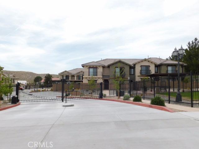 Nice gated complex in Desert Knolls, close to freeway and shopping. Move in ready, fully upgraded, nice play ground, granite counter tops, Master bedroom downstairs, second bedroom upstairs. Wont last long, make your appointment today. Association Amenities: On Site Management, Garage Special Features: Garage Door Opener, ADA
