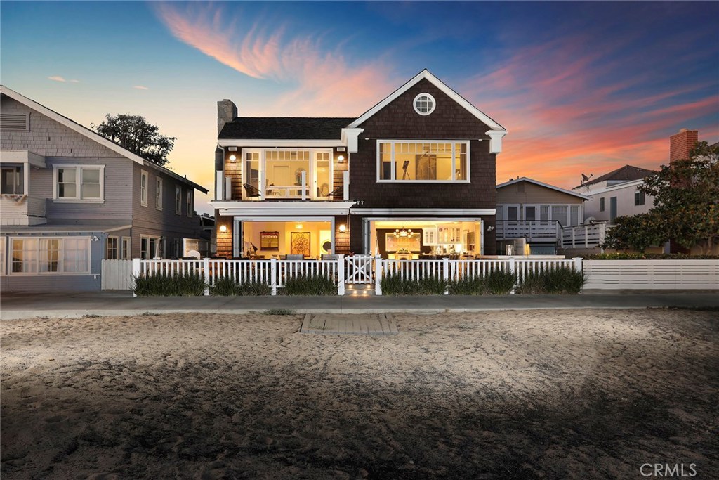 Refined and Inviting - perhaps the finest oceanfront property along the Balboa Peninsula Strand. Set on a rare forty-five foot wide parcel, this exquisitely appointed Cape Cod-Style home blends sophistication with style for a comfortable beach-chic aesthetic. The open-format floor plan was designed specifically for friends and family to gather and enjoy the indoor and outdoor living spaces. Walls of glass disappear onto an outdoor living room, complete with a built-in barbeque, kitchen area, and fire element. The sun-drenched great room with an adjoining dining area lead to the professional-grade kitchen complimented by gleaming stainless steel appliances, honed stone counters, custom lighting, a service island, and walk-in pantry. The adjacent media room, powder bath, and laundry area complete the first floor accommodations. The second-level living spaces are thoughtfully considered with four generously proportioned bedroom suites. The welcoming environs of the master suite provide panoramic views from the world famous Wedge to Catalina Island and the Pacific beyond. Dramatic, vaulted ceiling sleeping area, dual bath and dressing rooms, and an independent sitting room with an adjoining oceanfront terrace finish this master retreat. There is also an oversized three car garage and three adjacent parking spots. A rare commodity at the beach! An exceptional floor plan, conveyed with a relaxed seaside aesthetic are the hallmarks of this timeless Newport Beach oceanfront home.