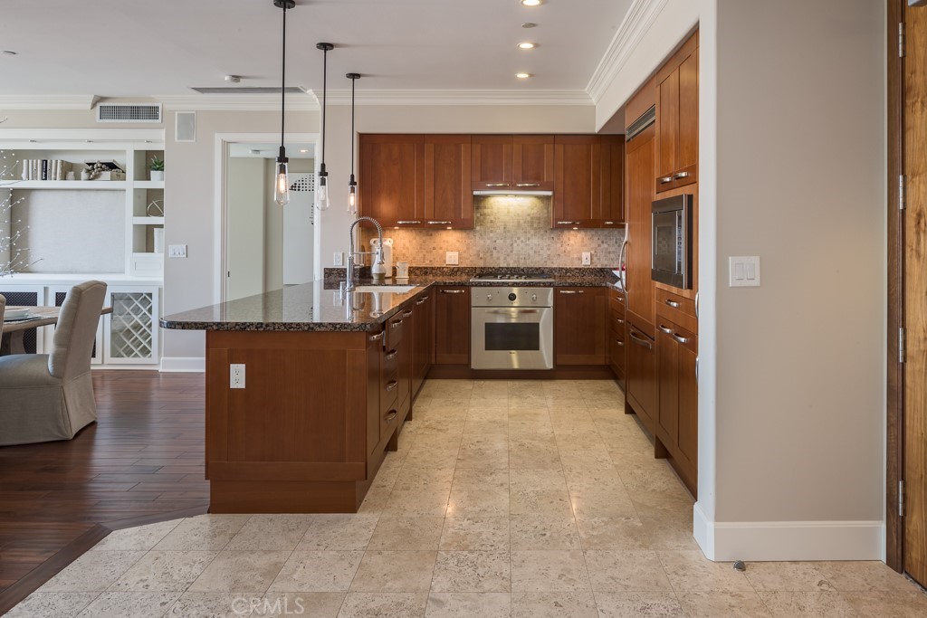 Luxe 14th floor highrise condo is located in the heart of Orange County in the sought after Plaza-Irvine. This southwest facing location features unobstructed views of the city lights and sunsets from Newport Coast to Catalina Island. This home has custom rich finishes throughout, including dark hardwood flooring, gourmet kitchen complete with Viking appliances, granite countertops, Snaidero European cabinetry, built in media center, and marble and granite baths. Just an elevator ride away are resort style amenities with 5000 sf gym quality fitness center complete with steam rooms, cabana lined Jr Olympic sized pool, spa, lap pool, dual club rooms, dual billiard rooms, a business center & outdoor entertainment center with bar-b-ques and planned social events. The rental price includes all utilities except electricity and cable TV and internet. Truly a lock-n-go luxury lifestyle center!