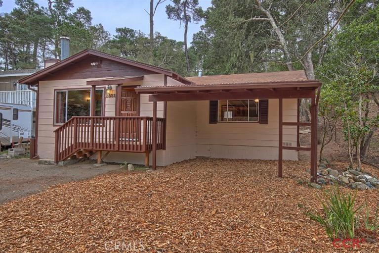 Off the beaten track, this single level, two bedroom, one bath home has open beam, vaulted wood ceilings, kitchen with newer tile counter, newer carpet and exterior paint, plus a large rear deck. The house is situated on an oversized double lot parcel. Lot Description: 50' x 80' apx