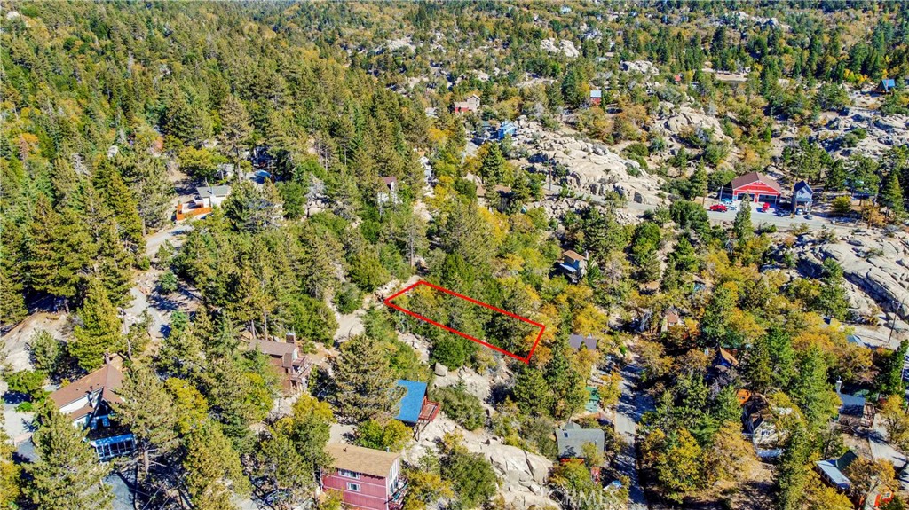 Drive by and envision your future cabin or home in this beautiful forest community. This lot is just under 3,000 sq. ft. along with beautiful scenery, sunrises, and sunsets. This community is not far from ski slopes, dining/entertainment, and multiple lakes providing fun all year long. Utilities appear to be located in the street for clarification please contact the utility company APN#0327-073-28-0000. Don't miss out on this great investment opportunity.