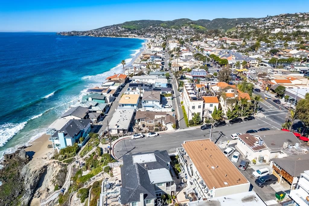 Incredible Value & Opportunity!! Extraordinary Laguna Beach Location!! This one of a kind property offers three spectacular beach villas (a duplex & a single family residence). The villas generated gross income well over $425K in 2022. These spectacular villas have the potential to generate income between $500K to $600K per year. Villas offer one of the highest CAP rates of over 4% & potential to exceed CAP rate of 5%. This gated World Class Laguna Beach residential family complex consists of 3 beautiful beach villas. Perhaps the most attractive and versatile multi-villas property currently available in the coastal areas of Orange County. Nestled on an approximately 7,200 sq. ft. lot immediately adjacent to the Cress Street Beach steps, and with parking for at least 6 vehicles. The property offers 3 lovely single-level villas with a total of 8 bedrooms, and 5.5 baths. Mixes of three villas: 2 bedrooms & 1 bath; 3 bedrooms & 2 baths; & 3 bedrooms & 2.5 baths (SFR). The family compound rests a short walk or ride from restaurants and shops in one of the area’s trendiest neighborhoods, the Hip district. Completely renovated and incorporating the finest materials & fixtures, each of the beach villas is worthy of the most discriminating guests or family members. Wide-plank wood & tasteful natural stone floors & shower walls, recessed lighting, crown molding & tray ceilings, stainless steel kitchen appliances, & luxurious bathrooms are only a few of the features contributing to the ambiance of casual sophistication. An expansive, multi-level courtyard features 4 fire pits & seating, with views of the ocean and spectacular sunsets. The investment & use options of this one-of-a-kind complex make it a superb prospect for immediate as well as long-term financial and tax benefits. Villas offer a viable 1031 exchange & enhance your great investment opportunity. Excellent use as a beach house for family & friends; as a second home & rent the villas as vacation or long term rentals as needed to supplement the income to offset property expenses. Very rare Laguna Beach short term rental license conveys with the property. Potential to add a second story to capture mesmerizing Panoramic Ocean/Coastal line views, Catalina Island, beautiful hills, & to increase the value significantly.