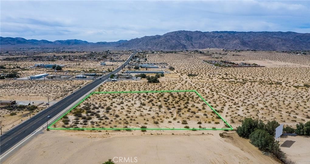 A great piece of Commercial property just off the corner of Adobe and Amboy in 29 Palms. Endless possibilities for development. 29 Palms, along with the entire High Desert is on the rise with a huge increase in tourism and population growth. The city is expanding with its downtown Phoenix Project, which is sure to attract more businesses as the city continues its upward trend. Don't miss this opportunity. Owner is open to carry with a reasonable down payment.