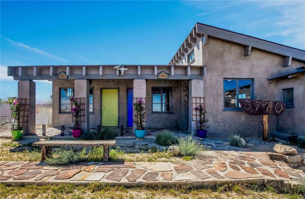 Historic 1938 Commercial Gem in Twentynine Palms.
Step into a piece of Twentynine Palms history. This beautifully restored 1938 commercial building was the original Desert Trail newspaper office. Thoughtfully renovated in 2024, this iconic property seamlessly blends vintage charm with modern convenience. Every detail was carefully preserved while incorporating brand-new energy efficient systems, including HVAC, plumbing, electrical, drywall, exterior plaster, new insulated roof, and lighting.
Spanning 1,301 square feet, the building features an open layout with private offices, two restrooms, and a kitchenette, offering flexible functionality. High vaulted wood-beamed ceilings add character, while multiple entrances enhance versatility for various business uses. A covered flagstone veranda faces Adobe Road, providing inviting curb appeal.
This distinctive space is ideal for a stylish salon, spa, medical office, or professional workspace. A rare opportunity for a visionary investor to own a timeless landmark and bring new life to a historic piece of Twentynine Palms. (Zoned General Commercial. Please see attached listing supplements).